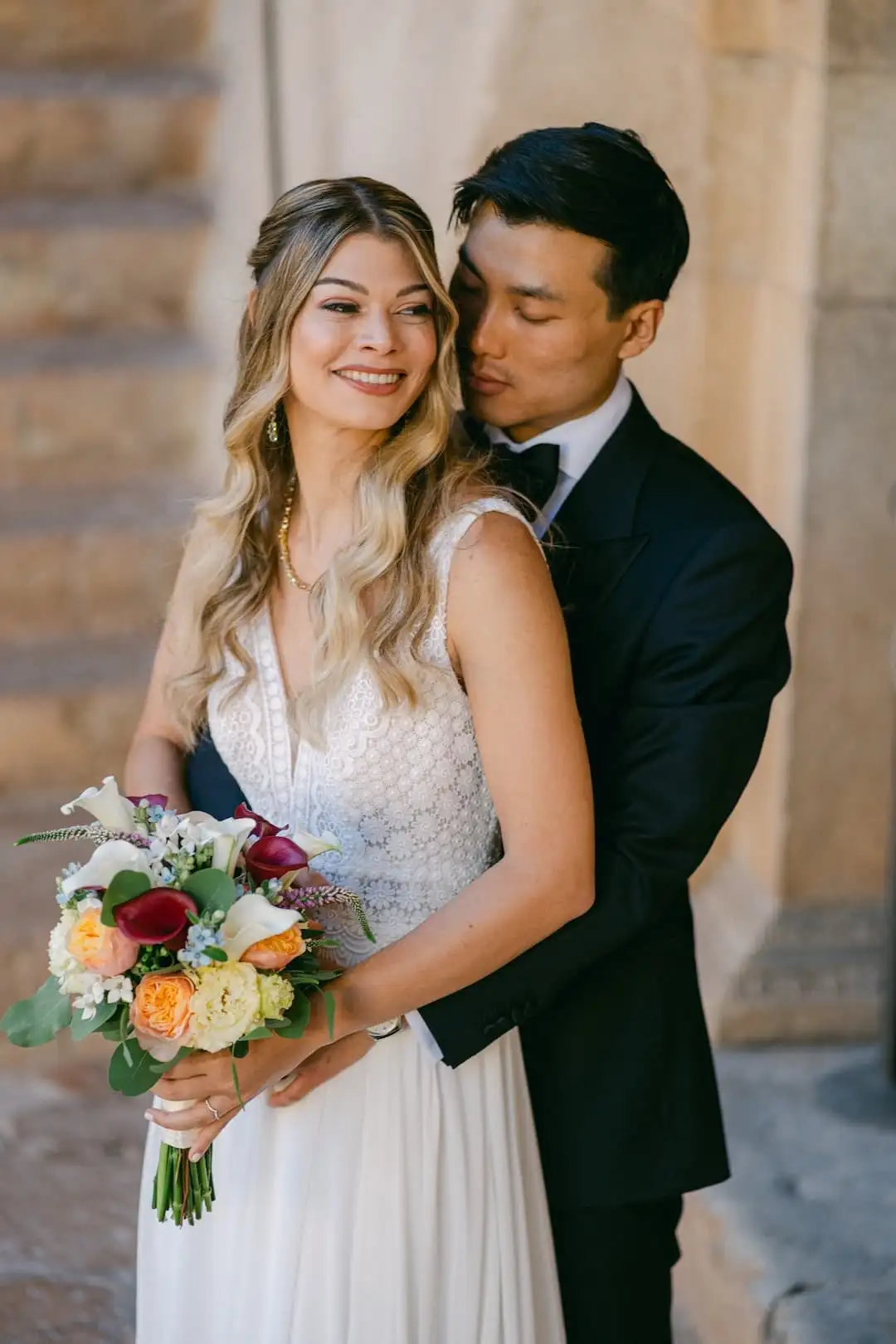Bride and groom in a quiet, close portrait during an intimate wedding in Italy