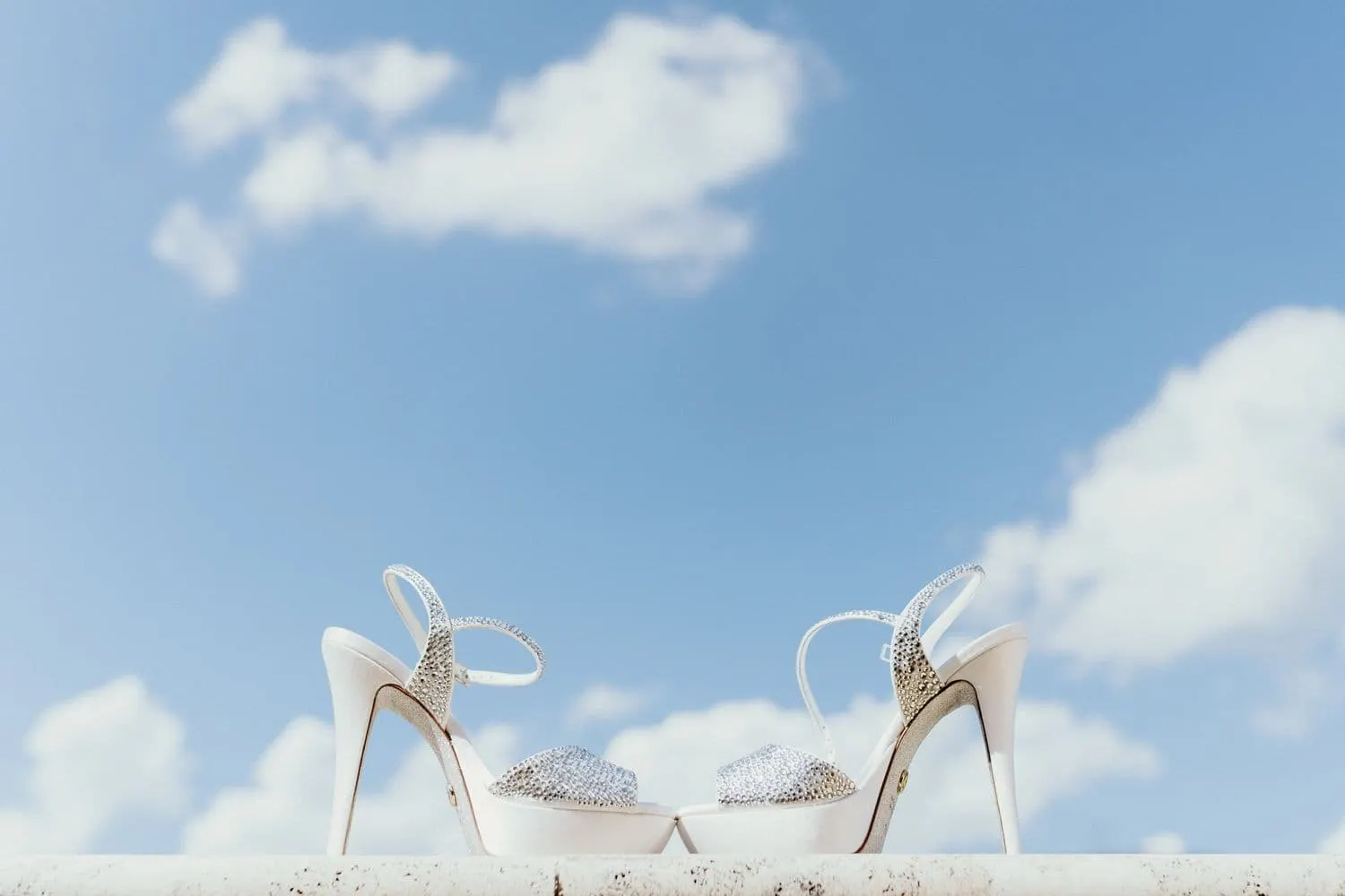 The bride's shoes photographed against the sky