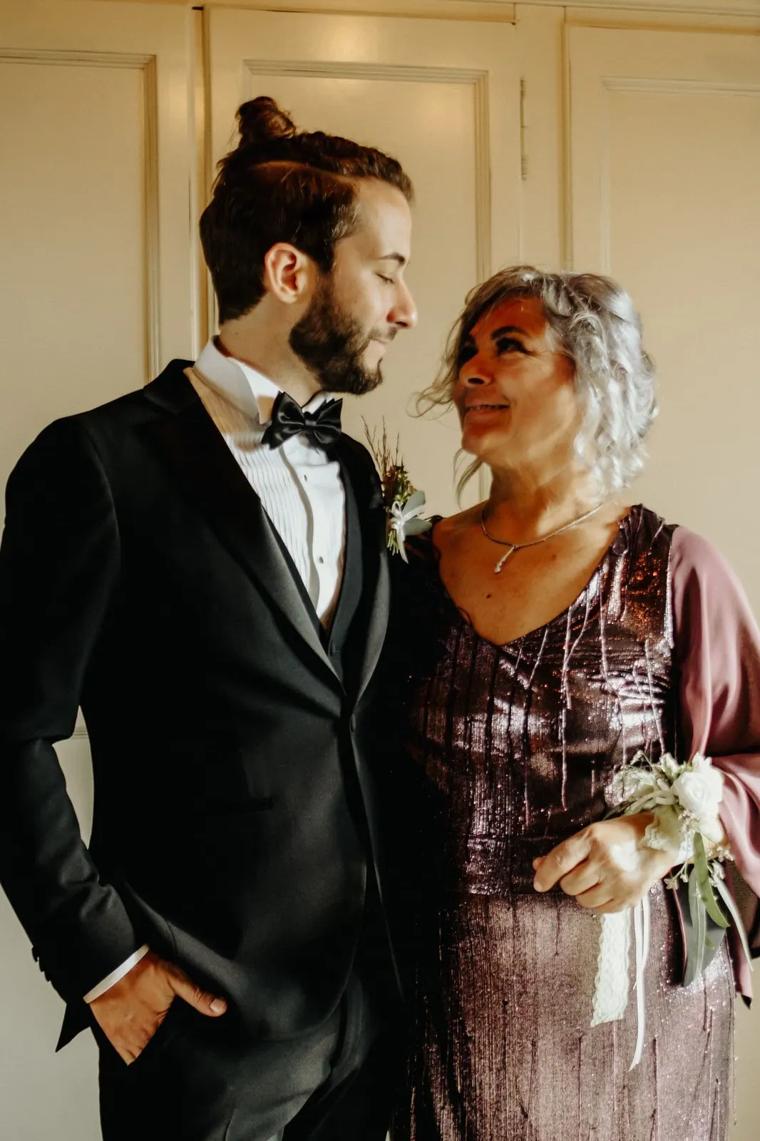 Raffaele and his mother smiling at each other