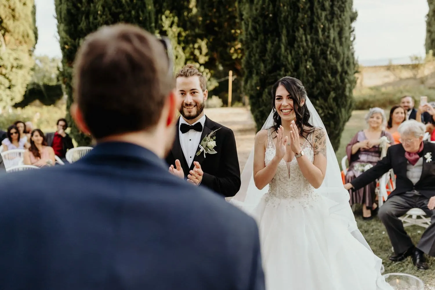 Micaela clapping and smiling during the ceremony