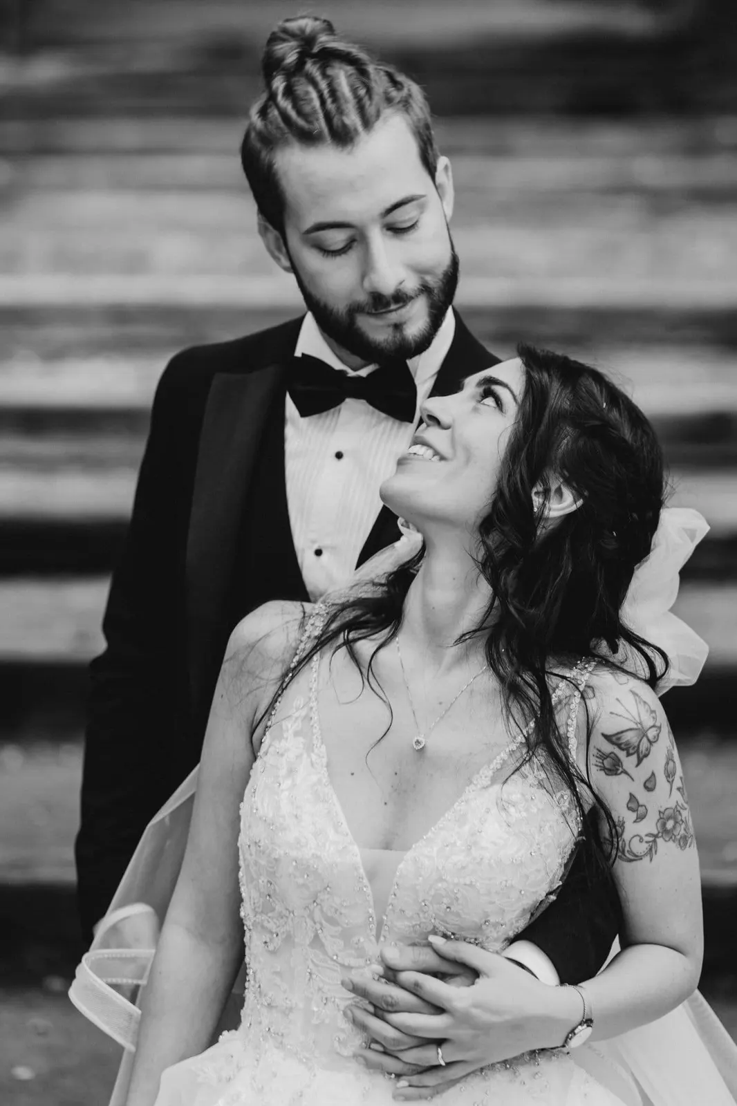 The couple embracing and looking at each other, in black and white