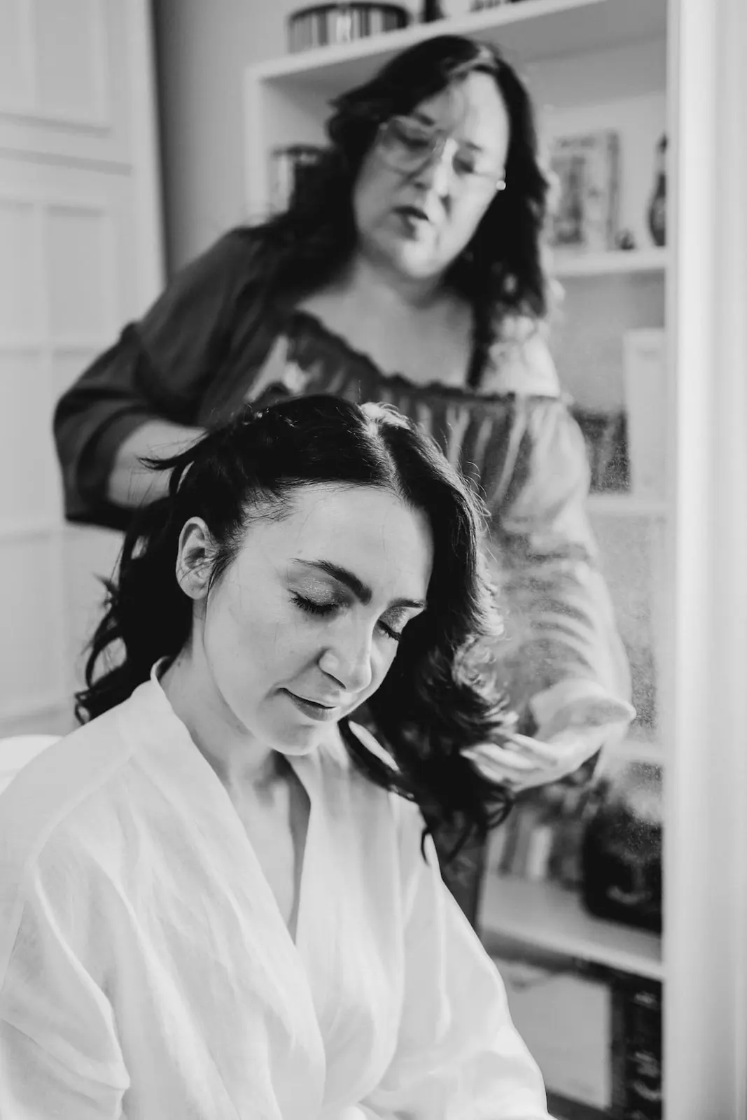 Valentina in her robe having her hair done, in black and white