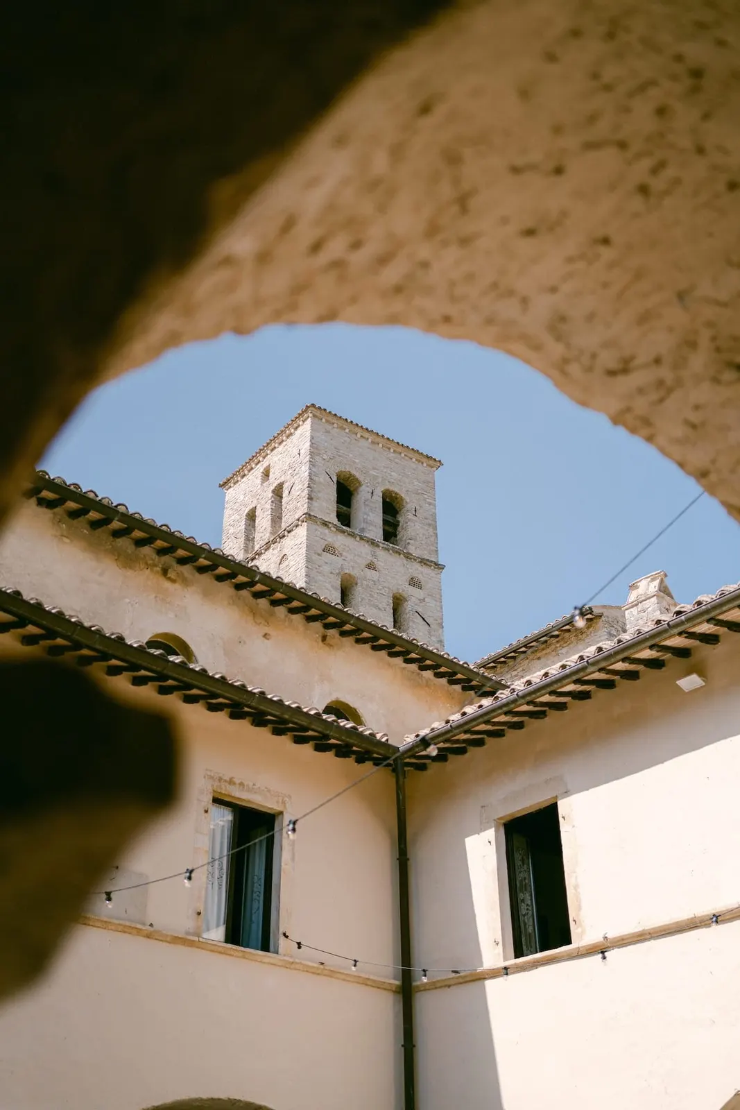 The abbey bell tower seen from under an arch