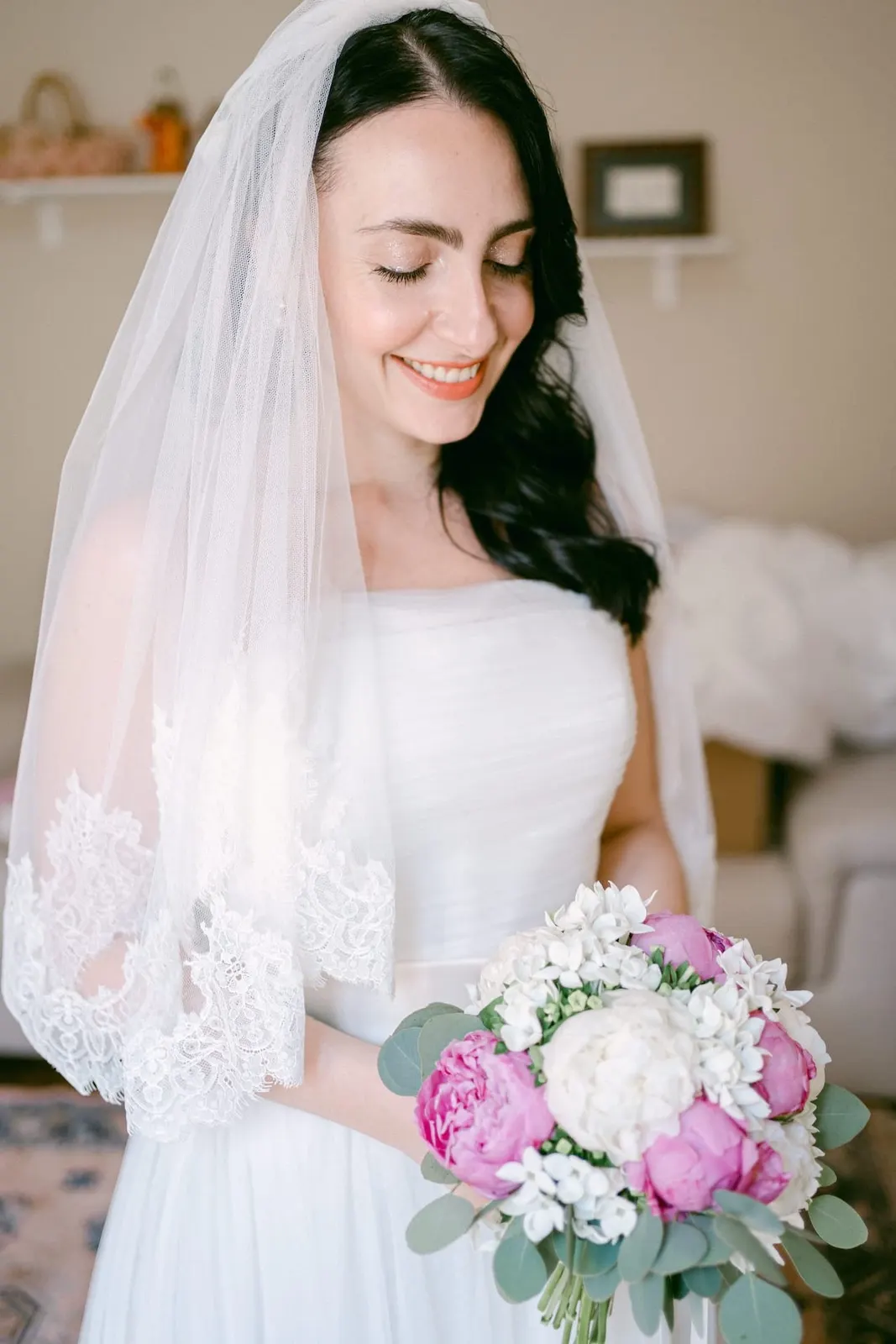 Portrait of Valentina with her lace-edged veil and bouquet