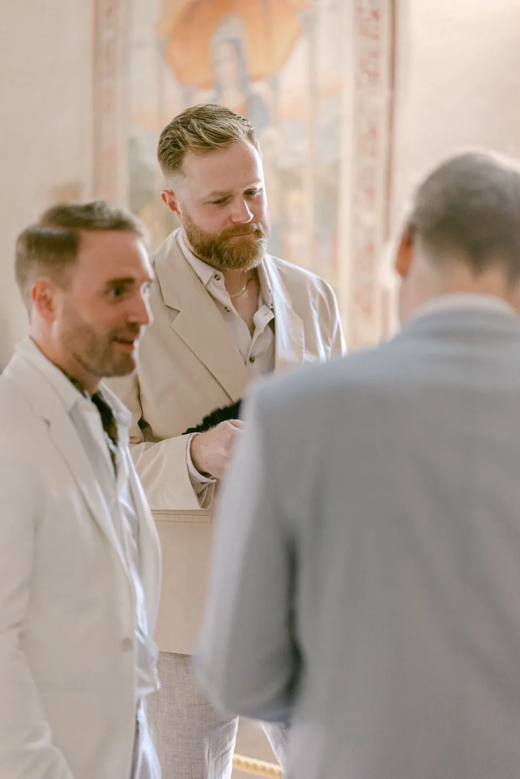 Thomas with two friends in church before the ceremony