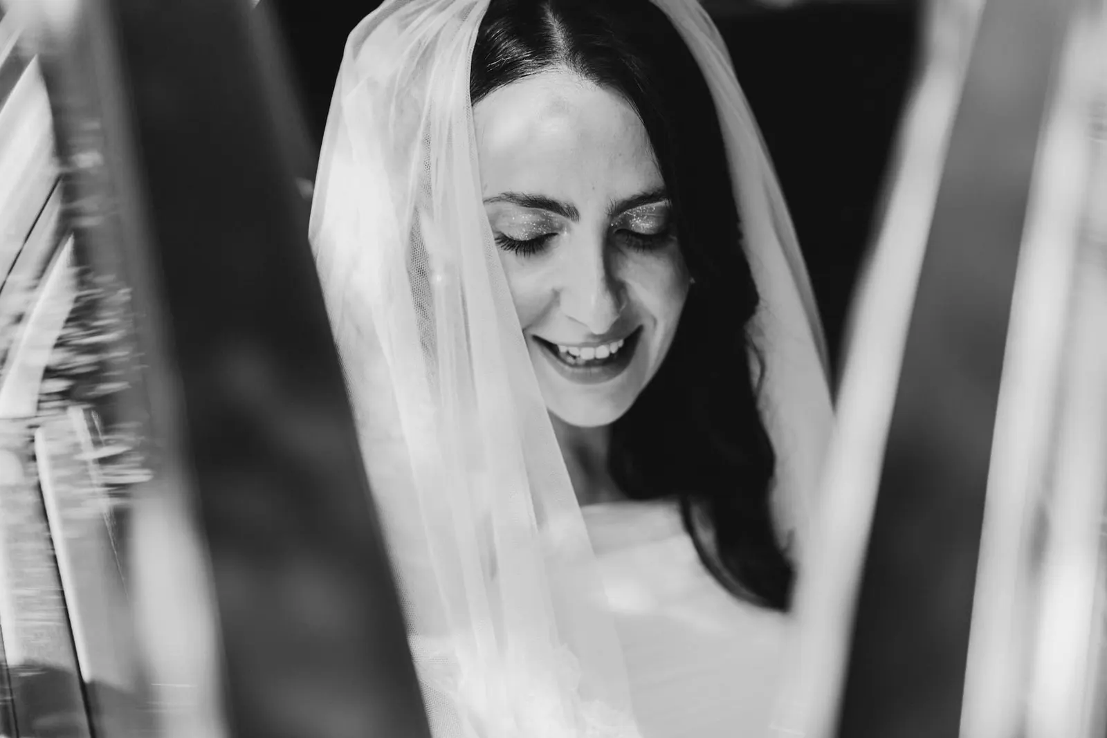 Valentina's smile under the veil, in black and white