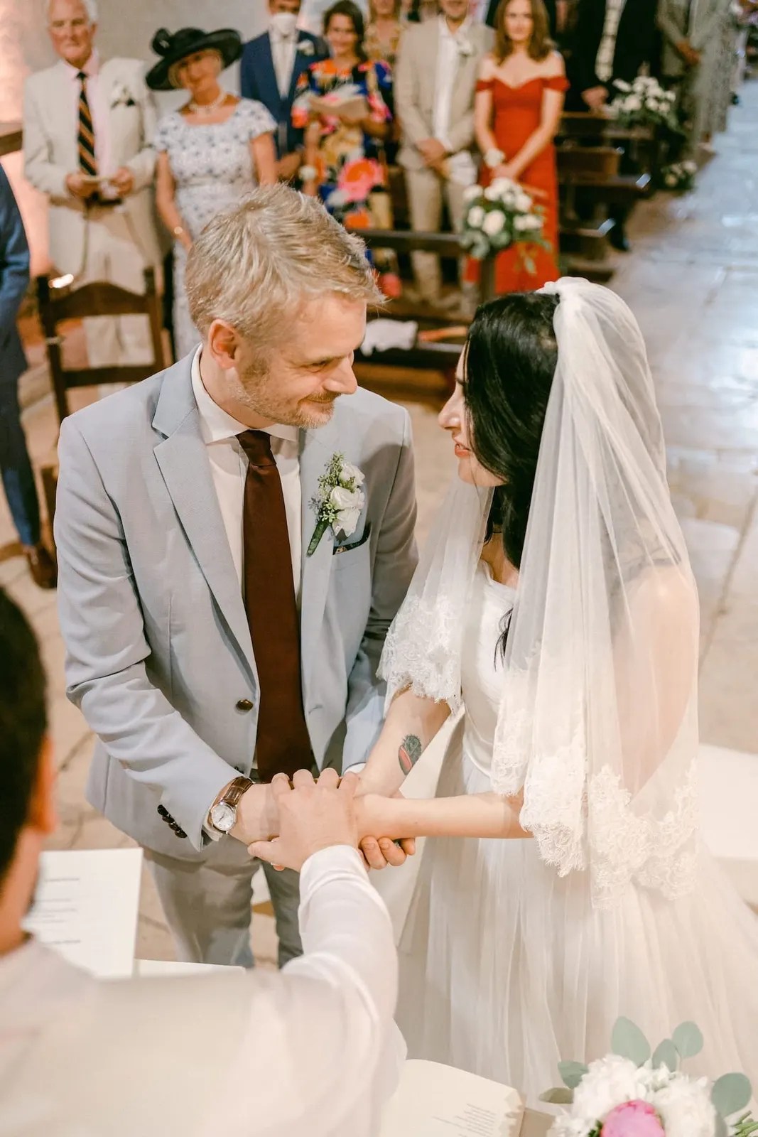 The exchange of rings in front of the guests