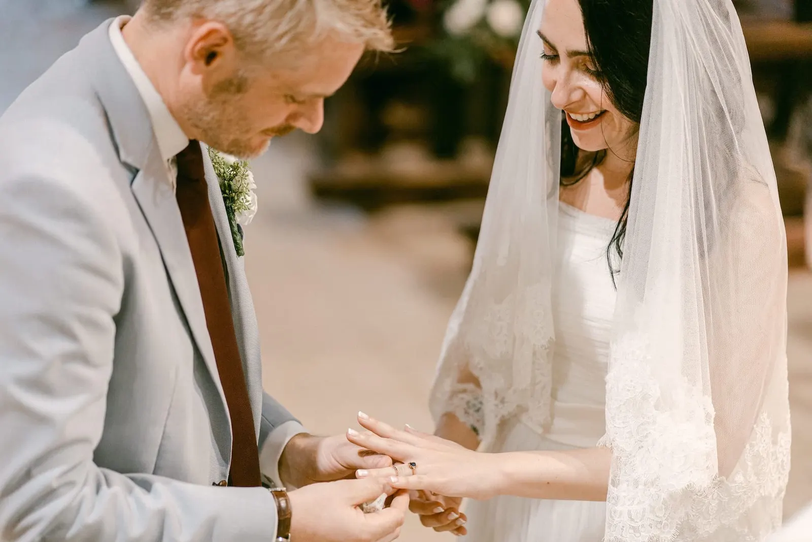 Thomas placing the ring on Valentina's finger