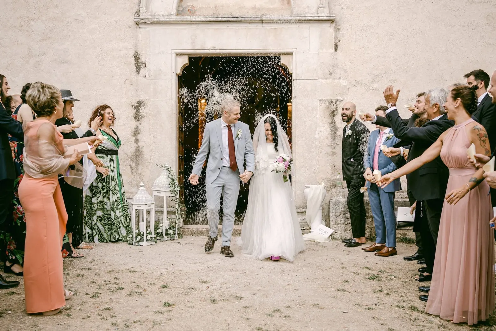 The couple's exit from the church through thrown rice and the guests