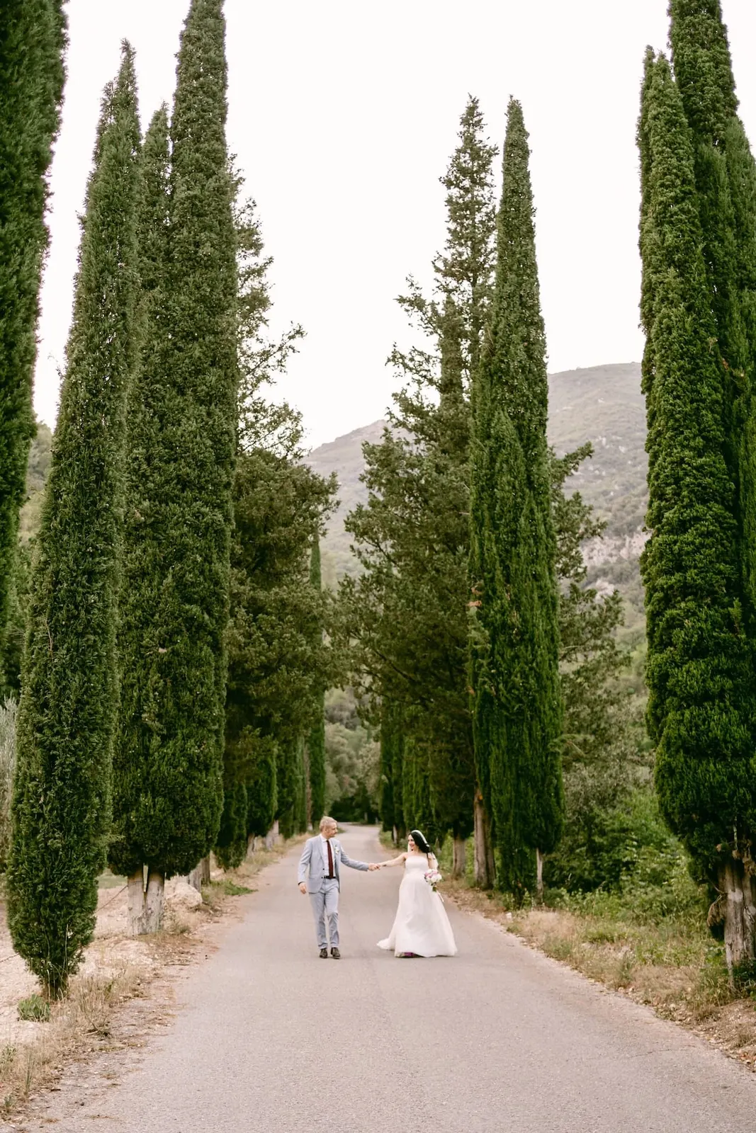 The couple in the distance in the cypress avenue