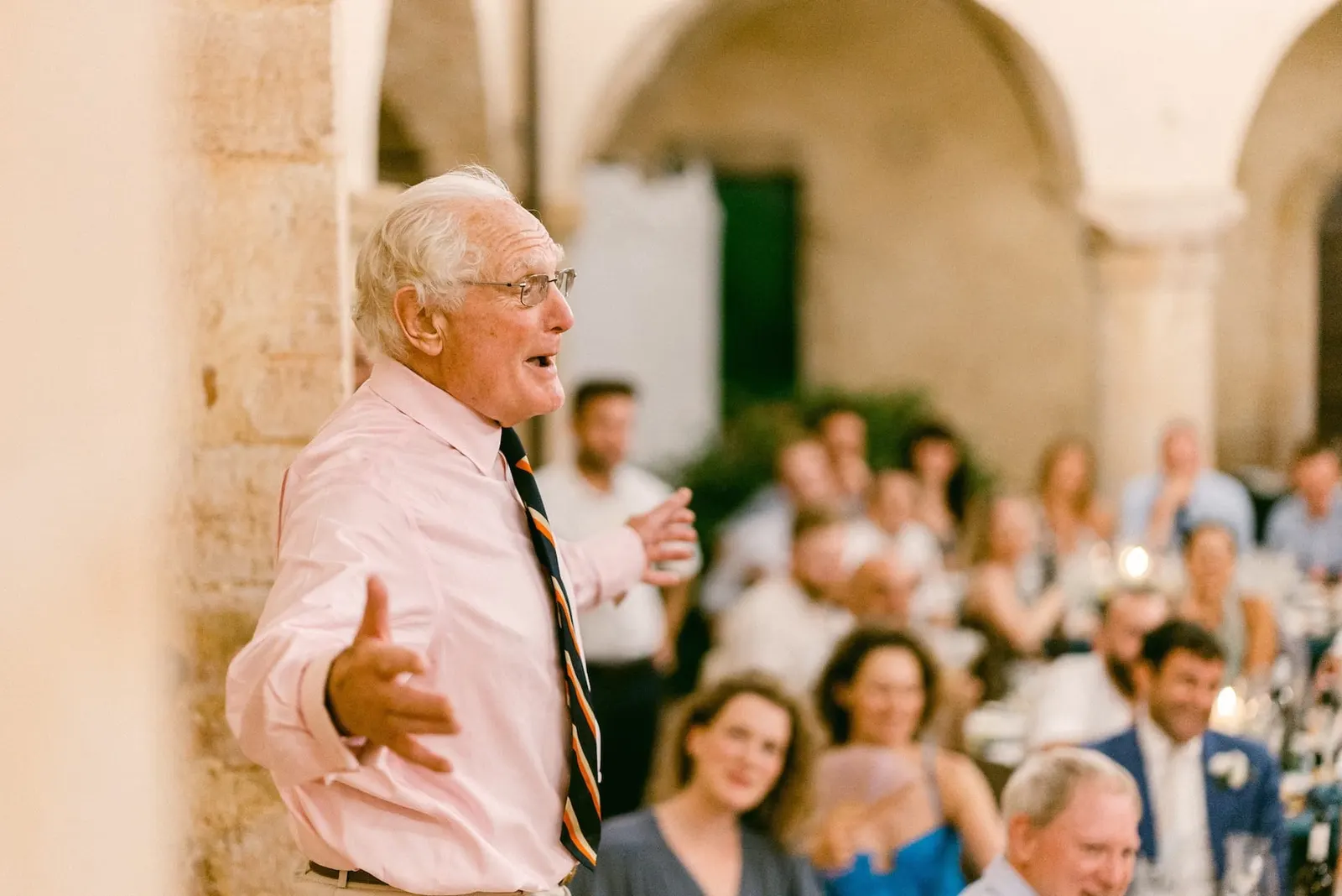 A speech given standing among the tables during dinner