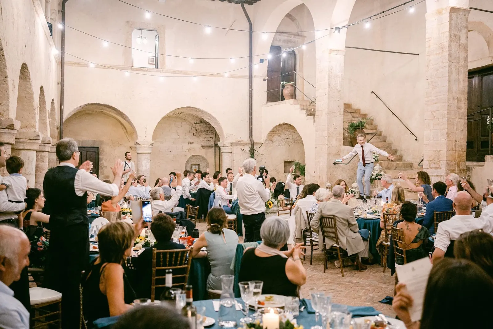 The cloister during dinner, with the speeches under the string lights