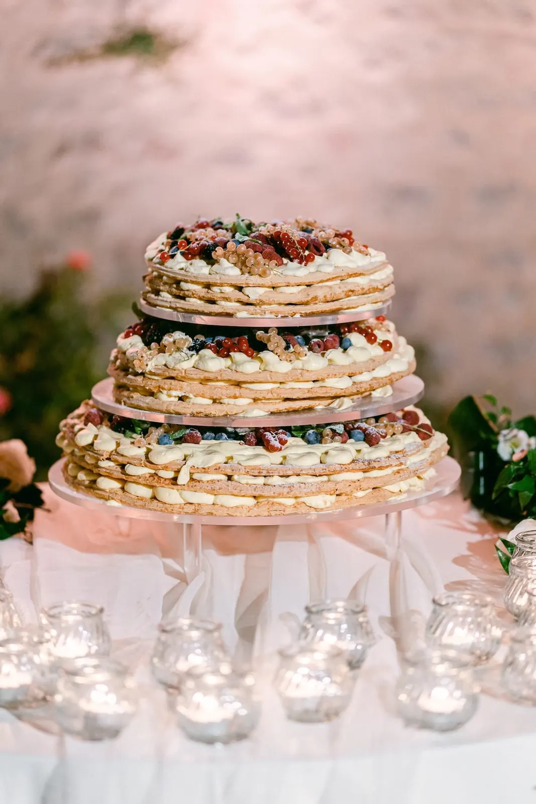 The wedding cake: a tiered millefoglie with berries