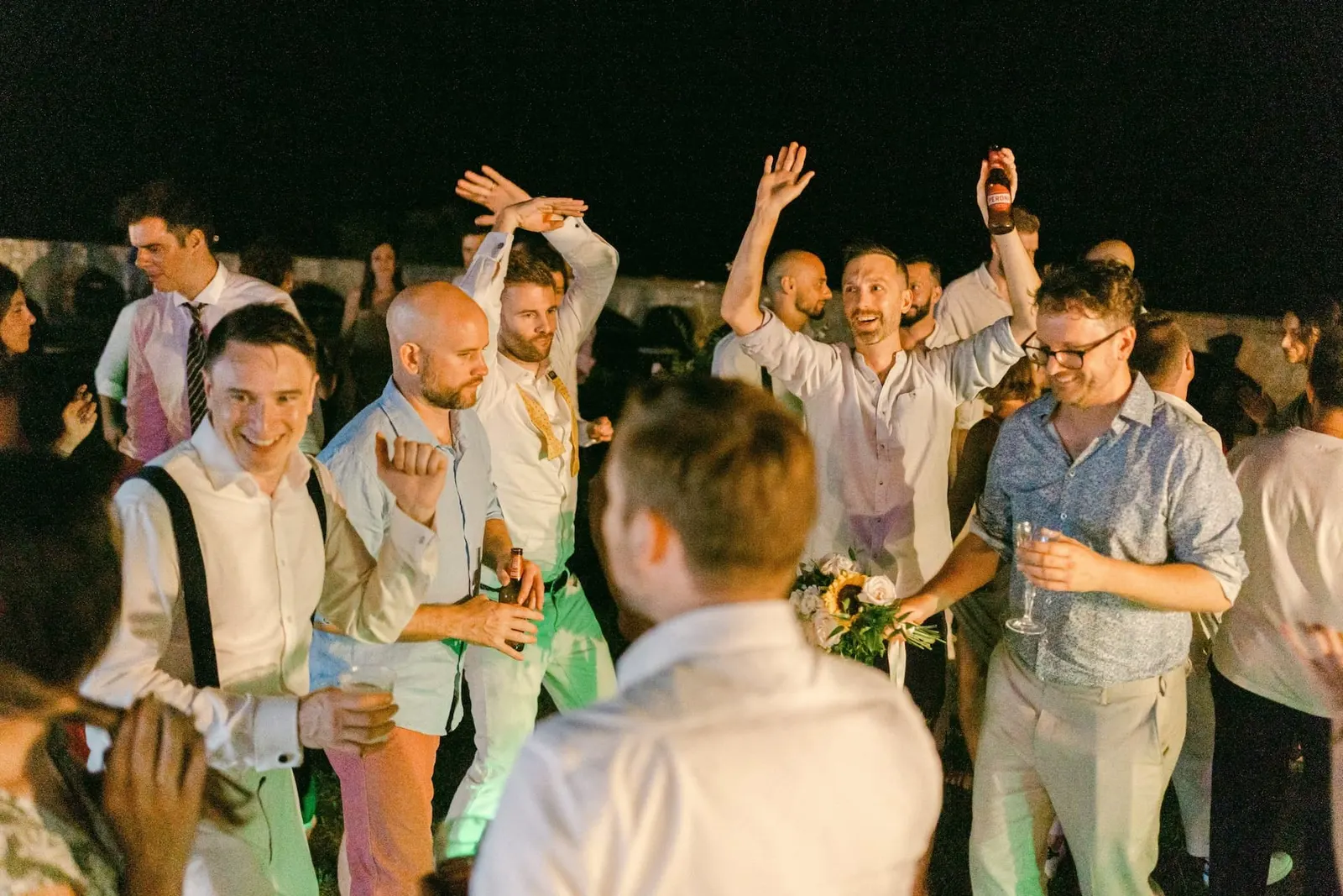 Friends dancing together at the end of the night