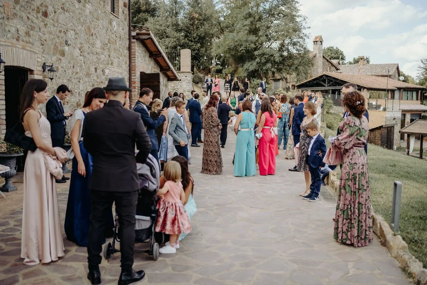 Guests arriving among the stone farmhouses of Borgo San Faustino